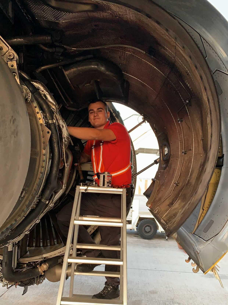Marcelo working on an aircraft engine becoming an aircraft maintenance engineer in the U.K.